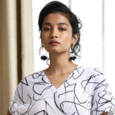 Gold in ring petal earrings color with black-toned accents